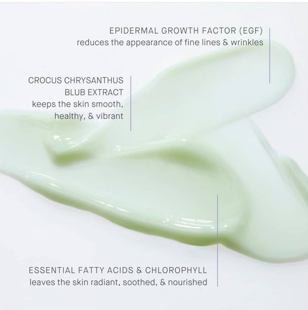 Smear of green creamy serum on white background with text bullet point.